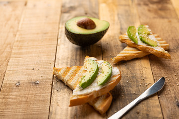 avocado sandwiches, Philadelphia cheese with toast and sesame and avocado slices, morning breakfast, healthy and clean food, with space