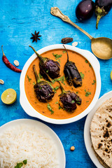 Baingan masala / Eggplant / brinjal curry served with chapati and rice, selective focus