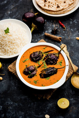 Baingan masala / Eggplant / brinjal curry served with chapati and rice, selective focus