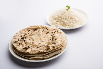 Chapati / Roti with Cooked plain rice, selective focus