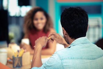 Image of two young businessmen at meeting