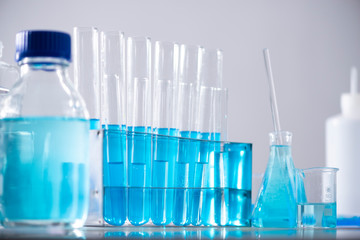 Test tube of glass overflows new liquid solution potassium blue conducts an analysis reaction takes various versions reagents using chemical pharmaceutics cancer manufacturing