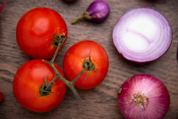 red vegetables set on wooden background