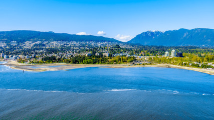 North Vancouver and West Vancouver across Burrard Inlet, the entrance into Vancouver harbor viewed from Prospect Point in Vancouver's Stanley Park 