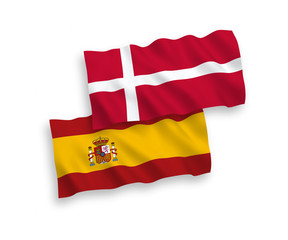 National vector fabric wave flags of Denmark and Spain isolated on white background. 1 to 2 proportion.