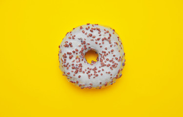 Fototapeta na wymiar Tasty donuts on pink background. National donuts day.