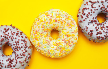 Tasty donuts on pink background. National donuts day.