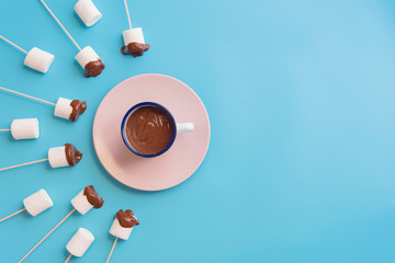 Marshmallows with chocolate in a beatiful background