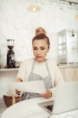 Smart woman working on development of her cafe.