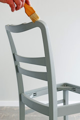 Man restoring old chair.