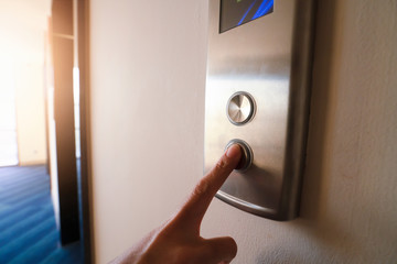 Naklejka premium Finger push Pointing up the elevator.
