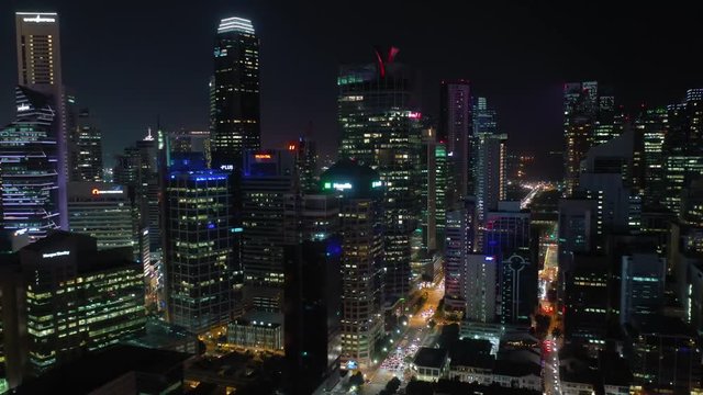 night time illumination singapore downtown traffic street aerial panorama 4k 