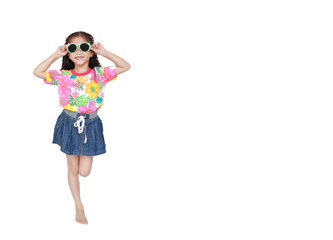 Smiling little Asian child girl wearing a floral pattern summer dress and sunglasses isolated on...