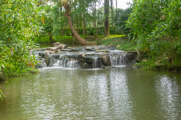 The trees and pond are in the garden that is beautiful and peaceful in Ratchaburi Thailand
