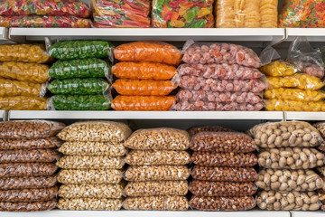 nuts and dried fruits. store shelves with dried fruit and nuts.