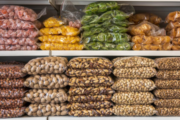 food in the market. nuts and dried fruits. store shelves with dried fruit and nuts.