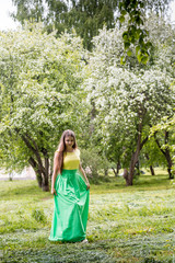 Fototapeta na wymiar Beautiful young woman near apple tree