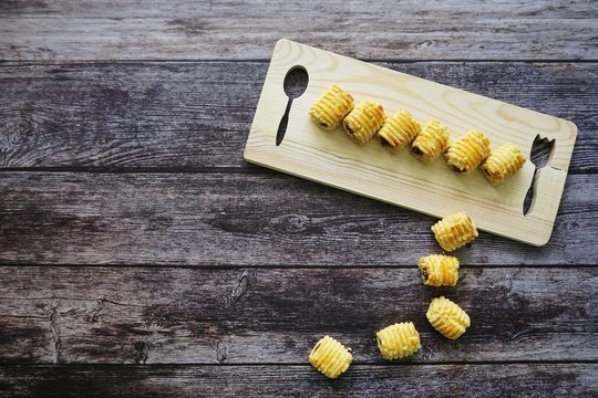 Traditional Malaysian cookies snack called "Tart Nenas" on wooden background