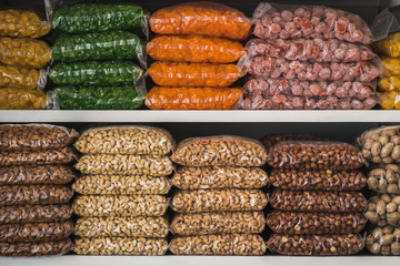 nuts and dried fruits. store shelves with dried fruit and nuts.