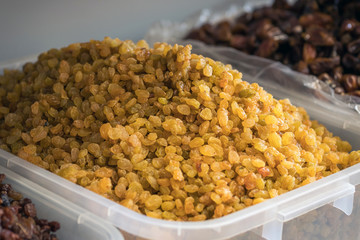 dried fruits in the market. dried raisins background.