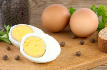 Sliced boiled eggs, with parsley leaves. Cooking a salad with boiled eggs.