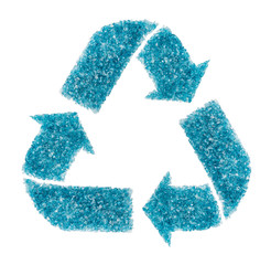 Recycling sign composed of broken turquoise glass fragments isolated on white background. The concept of glass recycling to improve the environment and reduce glass waste.