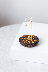 Tartlets with nuts and chocolate on marble background with copy space
