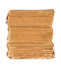 Side view a stack of three old, ancient books isolated on white background.