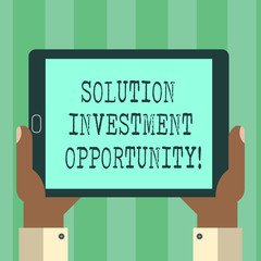 Handwriting text Solution Investment Opportunity. Concept meaning Strategies before undertaking a business Hu analysis Hand Holding Blank Screen Tablet Smartphone Display Unit photo