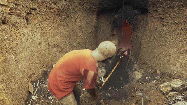 Man is shoveling out the banned limestone in Myanmar.