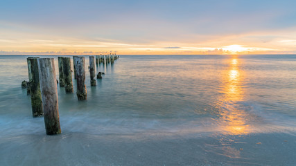 pier at sunset at wonderful beach near Naples, Florida