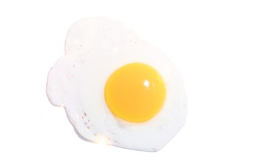 Fried yellow egg on white background