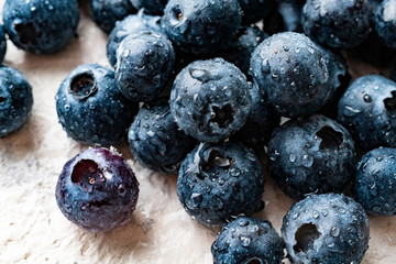 macro photo of fresh blueberry with water drops on its