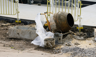 Concrete mixer with buckets on the construction site