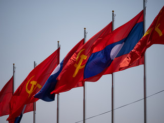 Loas and communists flags in Vientiane
