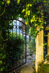 Ajar wicket to the garden in Hallstatt, Austria, at sunset.