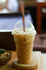 Close up espresso ice coffee on Wood table.