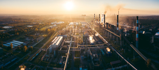 industrial landscape with heavy pollution produced by a large factory - obrazy, fototapety, plakaty