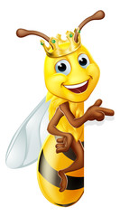 A queen or king bumble bee cartoon character in a gold crown peeking around a sign and pointing
