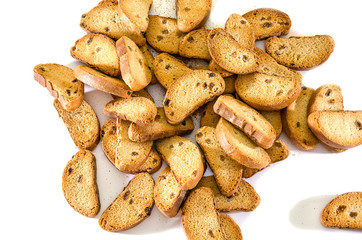 rusks with raisins on a white background. Big pile.