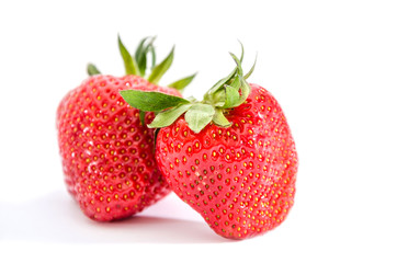 two strawberries isolated on white background