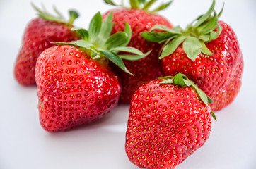 lots of strawberries close up on white background