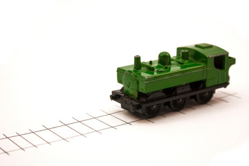 green toy locomotive on a white background