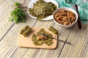 Preparation of dolmas in grape leaves