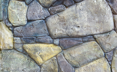 Background stone masonry of gray and yellow stones