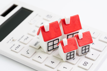 House cost calculation, mortgage and home loan or real estate price concept, group of miniature...