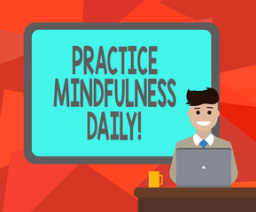 Word writing text Practice Mindfulness Daily. Business concept for Cultivating focus awareness on the present Blank Bordered Board behind Man Sitting Smiling with Laptop Mug on Desk