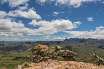 Wide view on top of the “Chameleon Mountain" in the Sacred Forest, Tsaranoro Valley Madagascar. With lizards and clouds overhead
