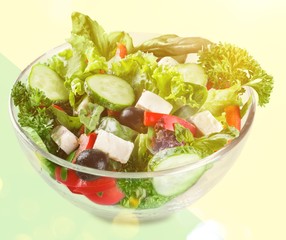 Closeup of Greek salad with feta cheese, cherry tomatoes and lettuce