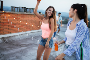 Happy young girls having fun at party